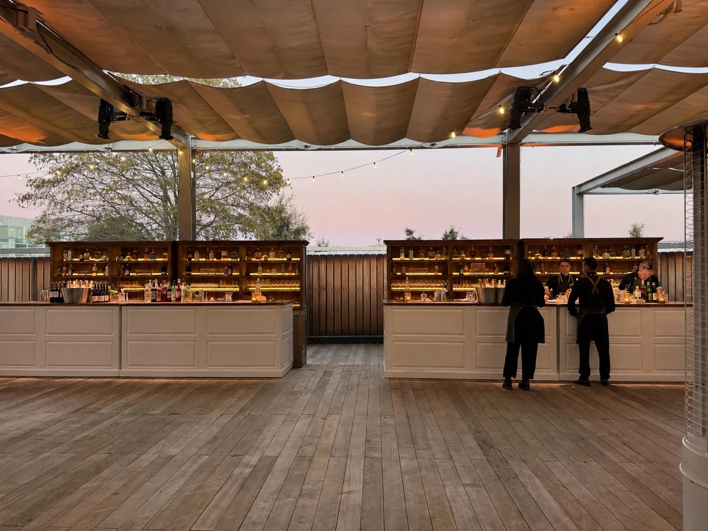 Digitally reconstructed view of the same outdoor event bars without plant styling