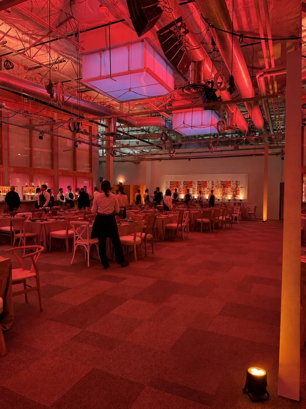 Digitally reconstructed view of the same red-lit corporate dinner without plant styling